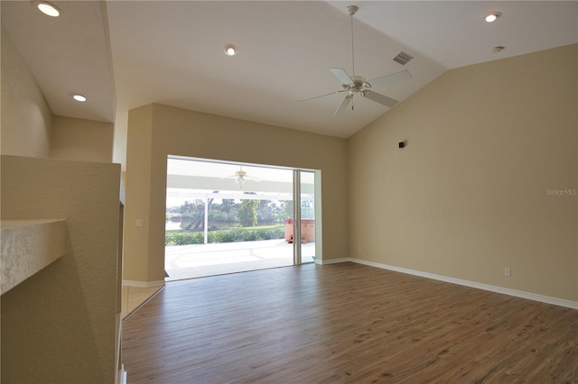 unfurnished living room with lofted ceiling, hardwood / wood-style floors, and ceiling fan