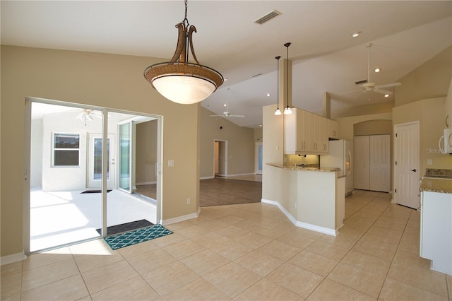 kitchen with hanging light fixtures, ceiling fan, high vaulted ceiling, and white appliances