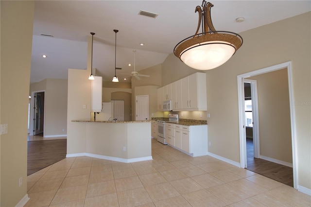 kitchen featuring light tile patterned flooring, white cabinetry, ceiling fan, kitchen peninsula, and white appliances