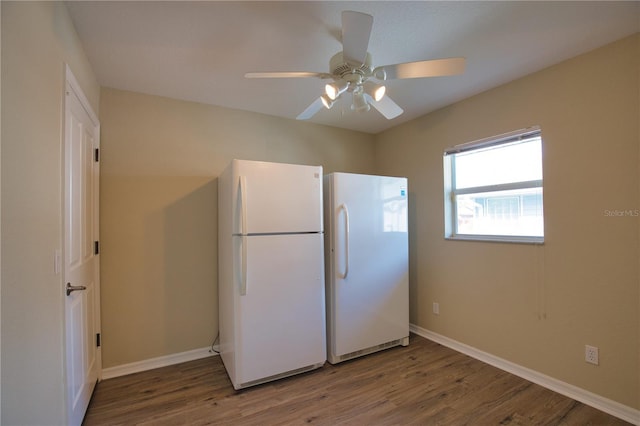 kitchen with hardwood / wood-style floors, ceiling fan, and white fridge