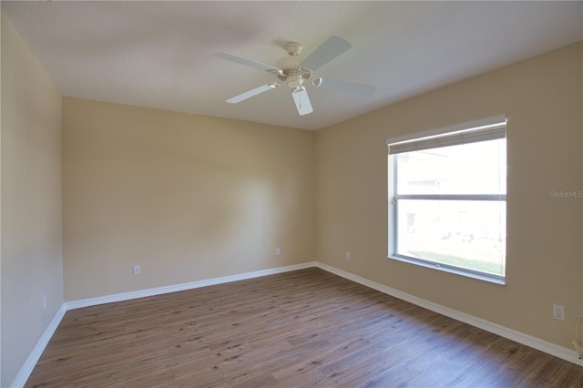 spare room featuring ceiling fan and light wood-type flooring