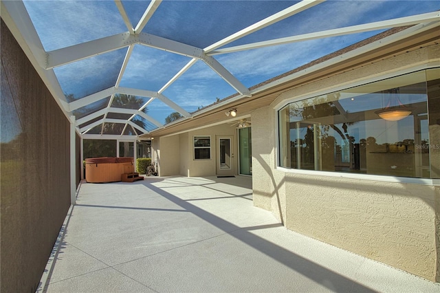 unfurnished sunroom featuring lofted ceiling