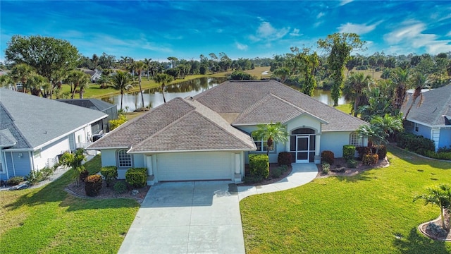 ranch-style home with a garage, a lanai, a water view, and a front lawn