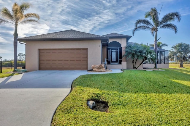 view of front facade with a garage and a front yard