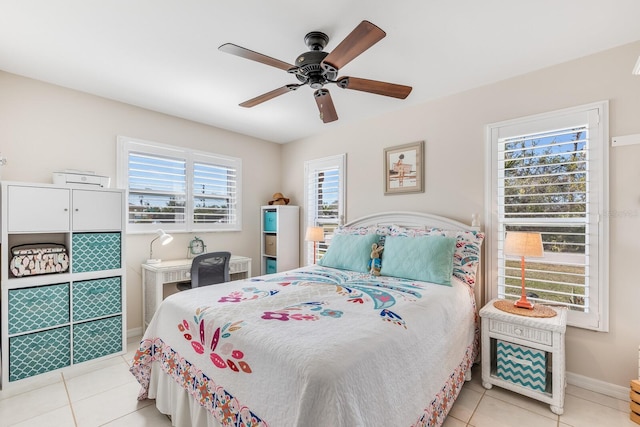 bedroom featuring light tile patterned floors and ceiling fan