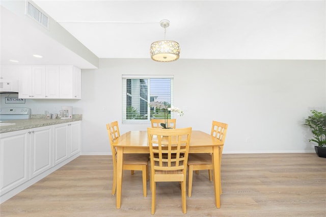 dining room with light hardwood / wood-style floors