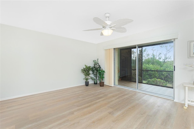 empty room featuring ceiling fan and light wood-type flooring