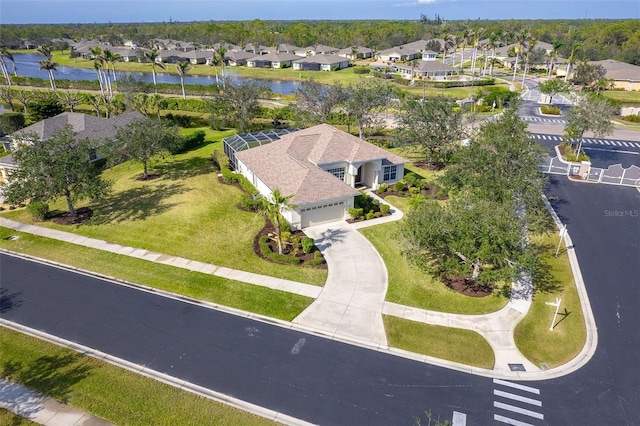 birds eye view of property with a residential view and a water view