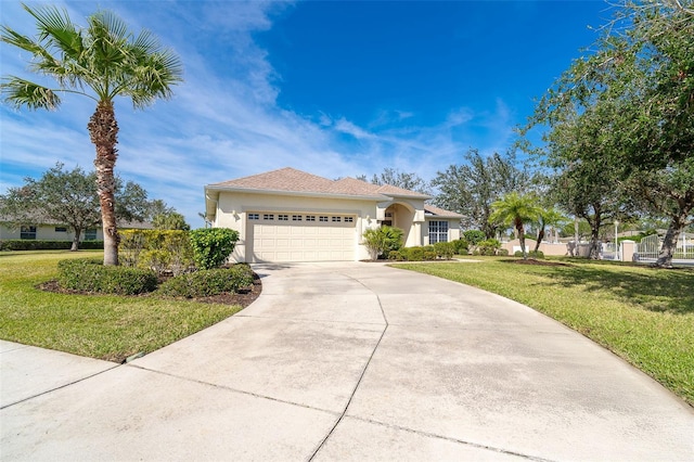 view of front of home with a garage and a front lawn