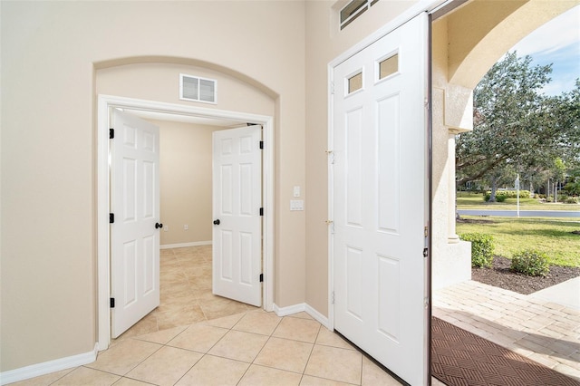 foyer entrance featuring light tile patterned floors