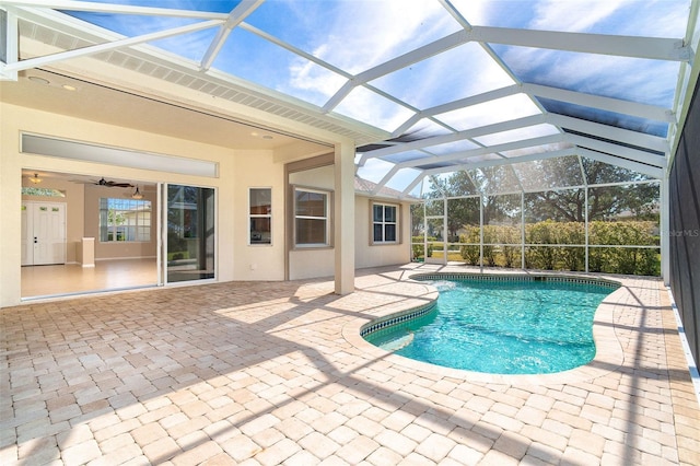 outdoor pool with a patio area