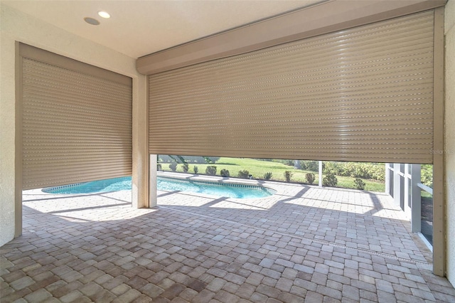 view of swimming pool with a patio area