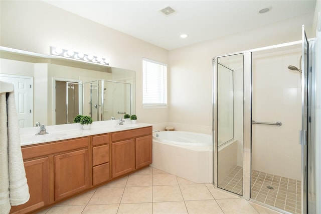 full bathroom featuring double vanity, a sink, a shower stall, tile patterned floors, and a bath