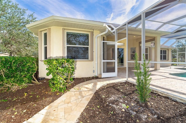 doorway to property with a patio area