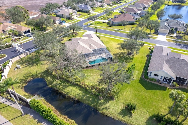 bird's eye view with a residential view and a water view