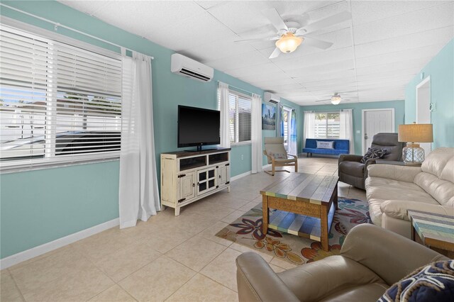 539 Shore Rd, Nokomis, FL 34275 - living area with a wall mounted air conditioner, ceiling fan, and light tile patterned floors