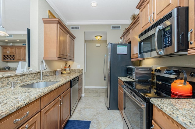 kitchen featuring sink, light tile patterned floors, ornamental molding, stainless steel appliances, and light stone countertops