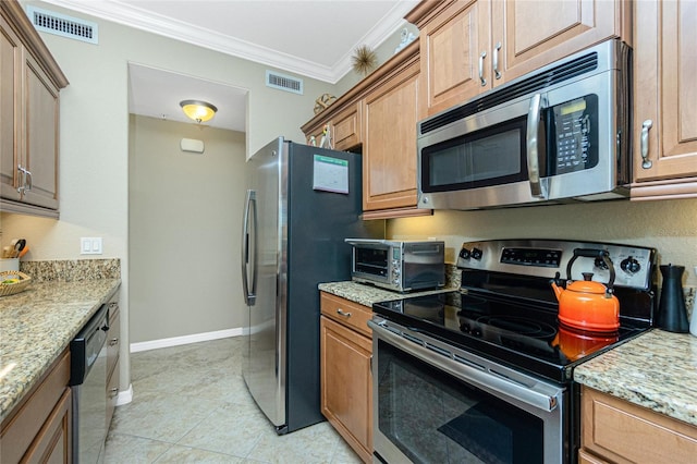 kitchen featuring ornamental molding, appliances with stainless steel finishes, light tile patterned floors, and light stone counters