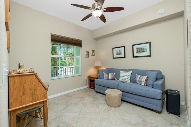 living room with ceiling fan and light tile patterned floors