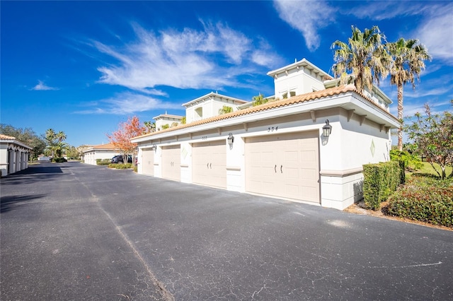 view of property exterior featuring a garage