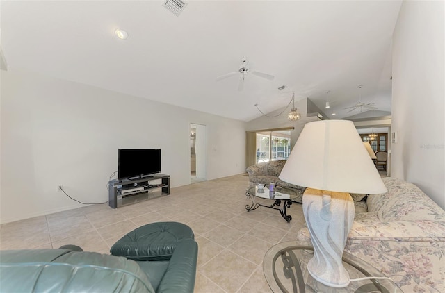 living room with lofted ceiling, light tile patterned floors, and ceiling fan