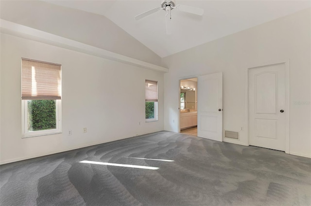 unfurnished bedroom with ceiling fan, connected bathroom, high vaulted ceiling, and carpet