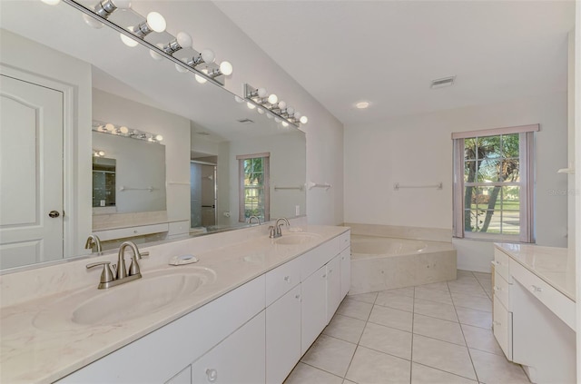 bathroom featuring tile patterned floors, independent shower and bath, and vanity