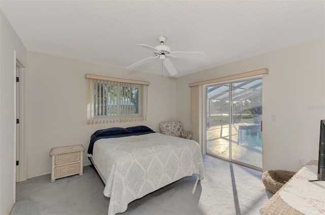 bedroom with ceiling fan, carpet flooring, and access to exterior