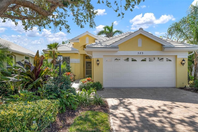 single story home featuring a garage