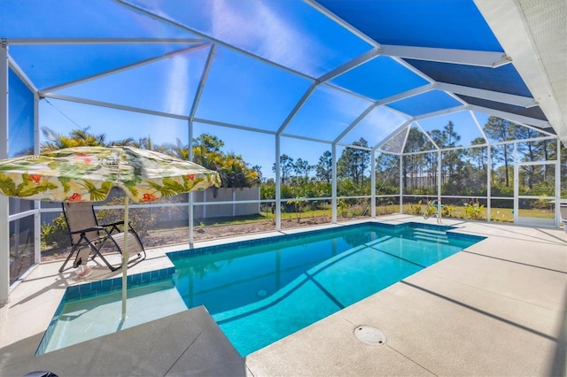 view of swimming pool featuring a lanai and a patio