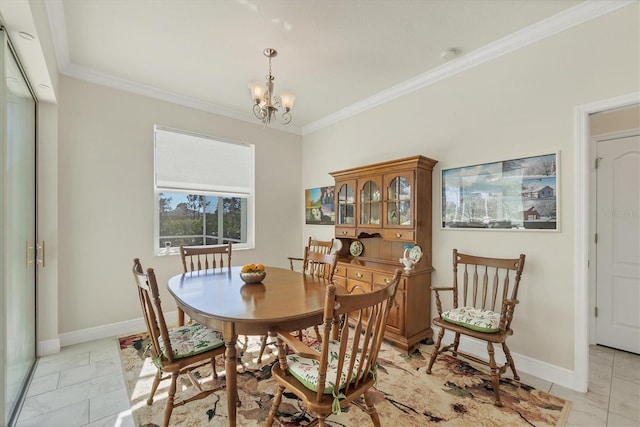 dining space featuring crown molding and a chandelier