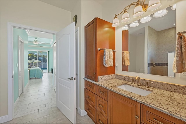 bathroom with ceiling fan, vanity, and tile patterned floors