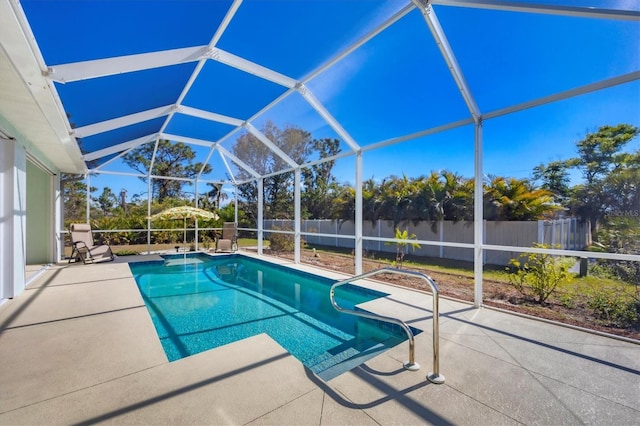 view of pool with a lanai and a patio area