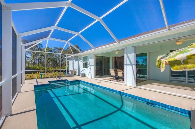 view of pool featuring a lanai and a patio