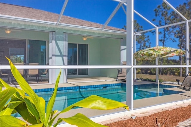 view of swimming pool with a lanai and a patio