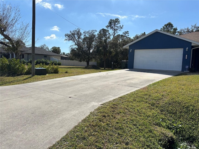 exterior space featuring a garage and a lawn