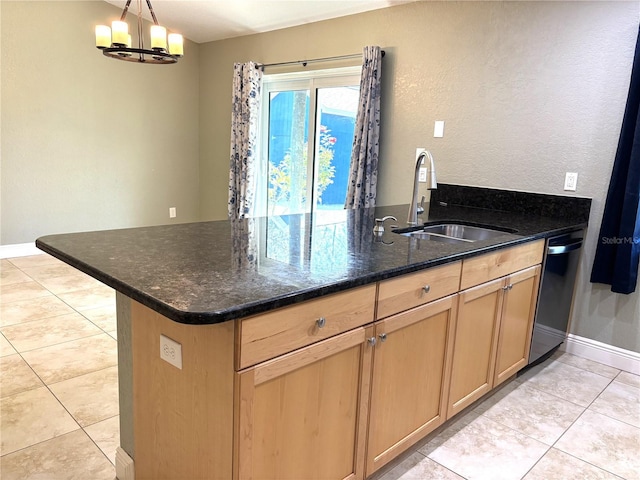 kitchen with sink, decorative light fixtures, stainless steel dishwasher, a notable chandelier, and dark stone counters