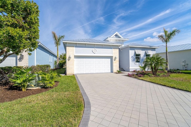 single story home with a garage and a front yard