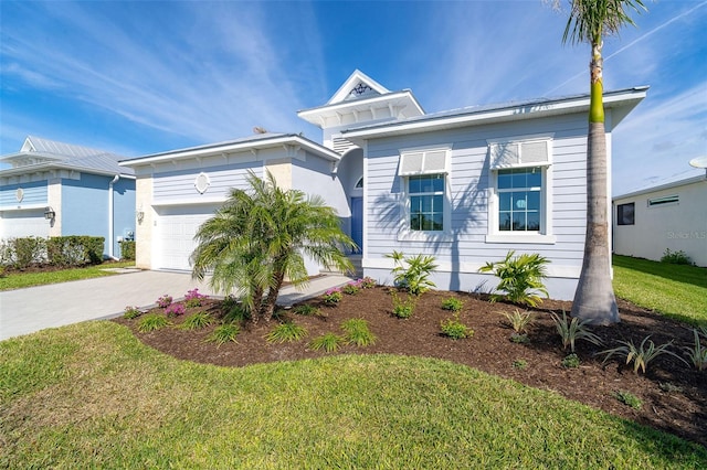 view of front facade with a garage and a front lawn