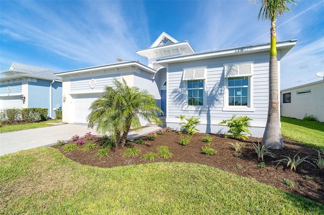 view of front of house featuring a garage and a front yard