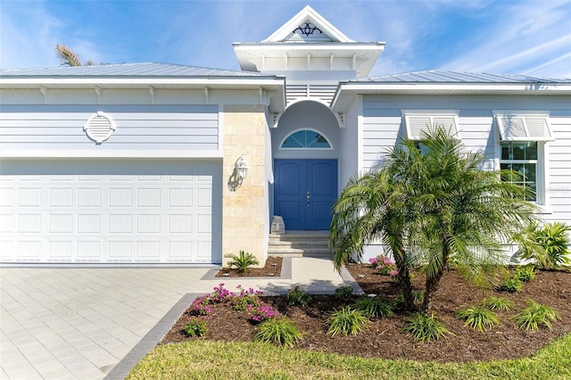 view of front of property featuring a garage