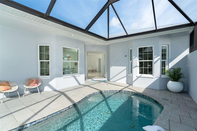 view of swimming pool with a patio area