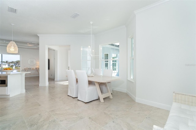 dining area with ornamental molding and a wealth of natural light