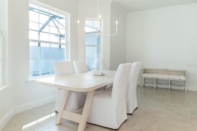 dining area featuring crown molding and a notable chandelier