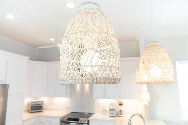 interior space with white cabinetry, ornamental molding, and electric stove