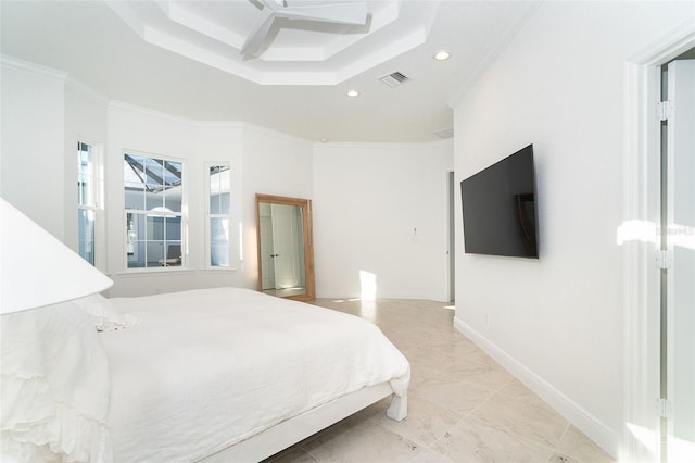 bedroom featuring a tray ceiling, ornamental molding, and a high ceiling