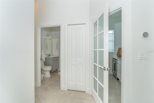 bathroom with vanity, toilet, and tile patterned flooring