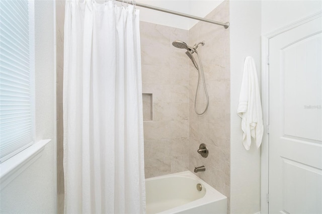 bathroom with shower / tub combo