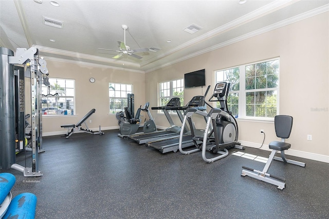 workout area featuring ornamental molding and ceiling fan