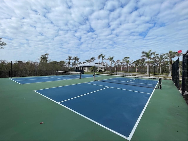 view of sport court with basketball hoop